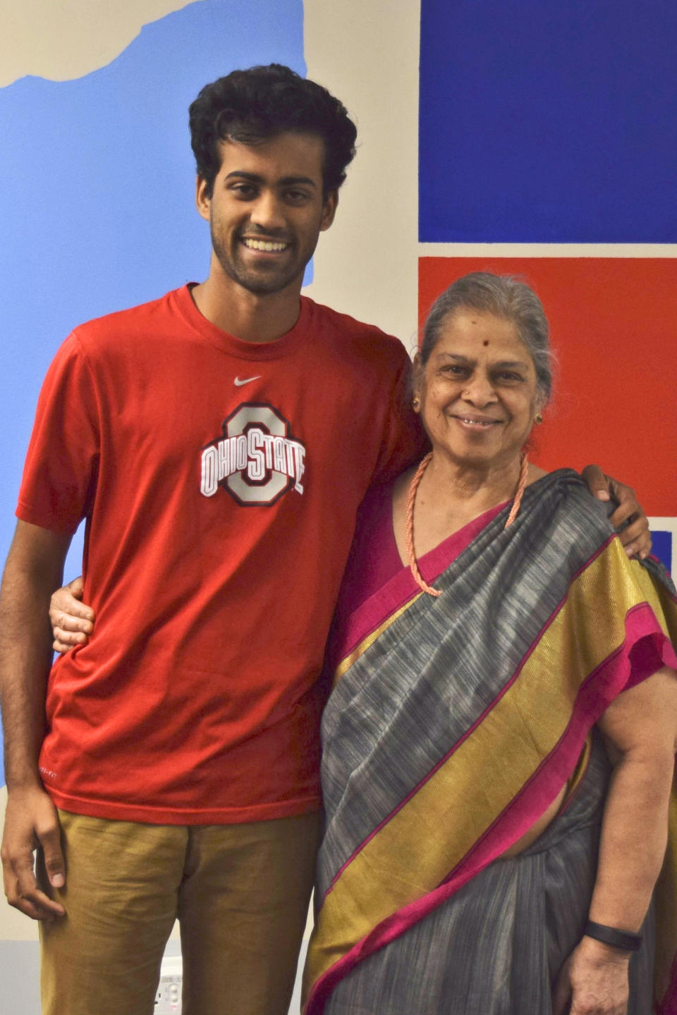 In this photo provided by courtesy of Arman Ramnath, Ramnath poses with his grandmother, Saroja Seetharaman, Oct. 5, 2016, in Columbus, Ohio. In Ramnath’s family, his India-born maternal grandmother, Seetharaman, rotates among her three children and their six grandchildren, in Dallas, Atlanta and his Columbus home. The pandemic and its isolating restrictions have been especially tough for many of the nation's some 70 million grandparents, many at ages when they are considered most vulnerable to the deadly COVID-19 virus. (Arman Ramnath via AP)