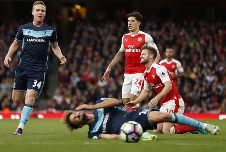 Britain Soccer Football - Arsenal v Middlesbrough - Premier League - Emirates Stadium - 22/10/16 Arsenal's Shkodran Mustafi reacts after challenging Middlesbrough's Gaston Ramirez as Hector Bellerin and Adam Forshaw look on Action Images via Reuters / John Sibley Livepic EDITORIAL USE ONLY.