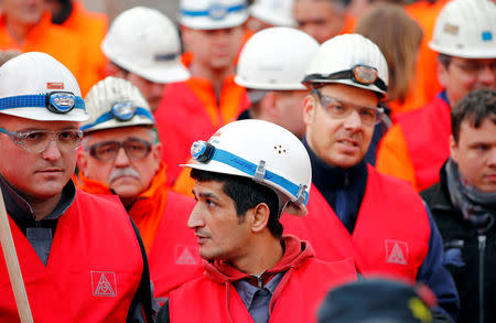 FILE PHOTO: Workers of German steel maker ThyssenKrupp AG protest in a warning strike organised by German union IG Metall for higher wages at the ThyssenKrupp steel Europe plant of Dortmund, Germany, February 4, 2019. REUTERS/Wolfgang Rattay/File Photo