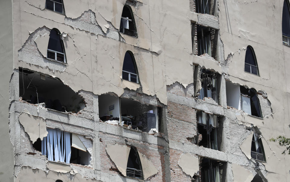 <em>Remains of a damaged building stands after the earthquake struck (AP)</em>