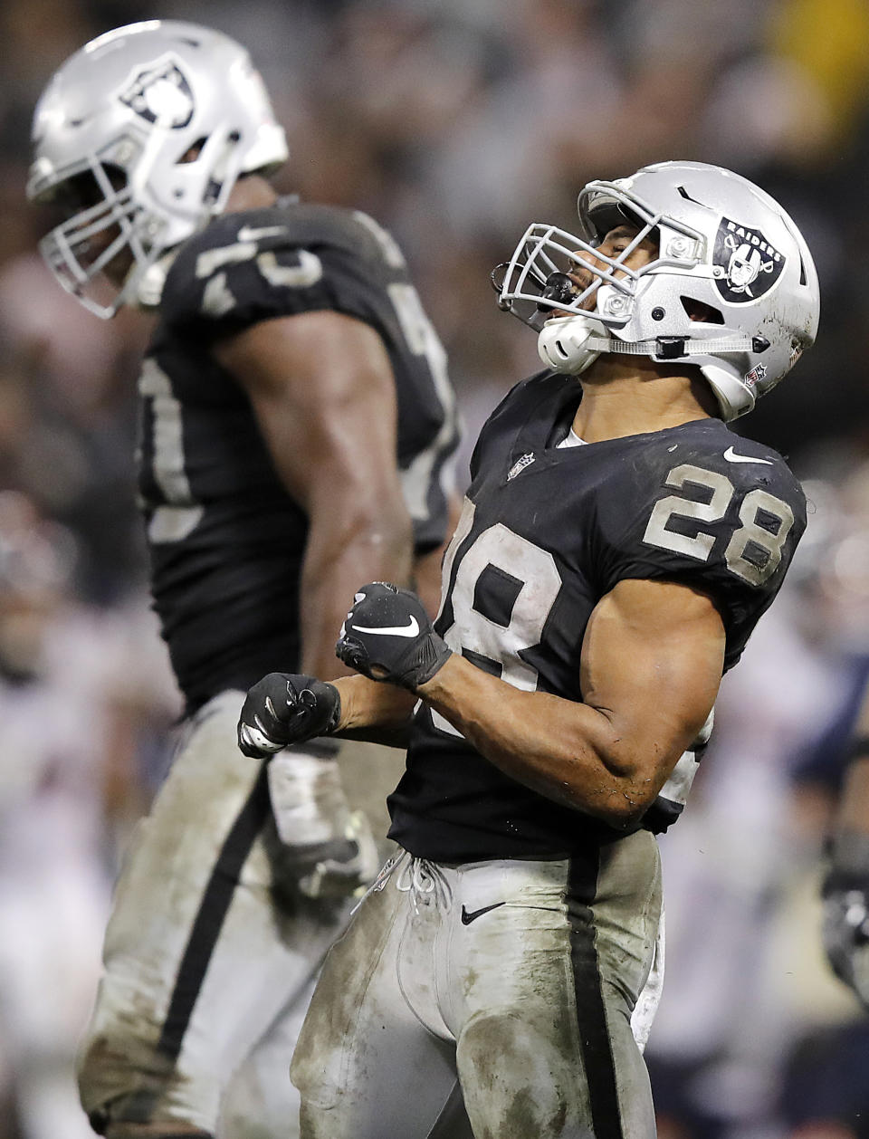 Oakland Raiders running back Doug Martin (28) celebrates during the second half of an NFL football game against the Denver Broncos in Oakland, Calif., Monday, Dec. 24, 2018. (AP Photo/John Hefti)