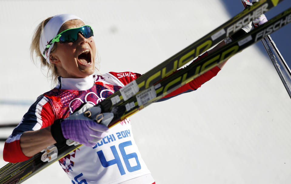 Norway's Therese Johaug celebrates winning the bronze during the women's 10K classical style cross-country race at the 2014 Winter Olympics, Thursday, Feb. 13, 2014, in Krasnaya Polyana, Russia. (AP Photo/Matthias Schrader, File)