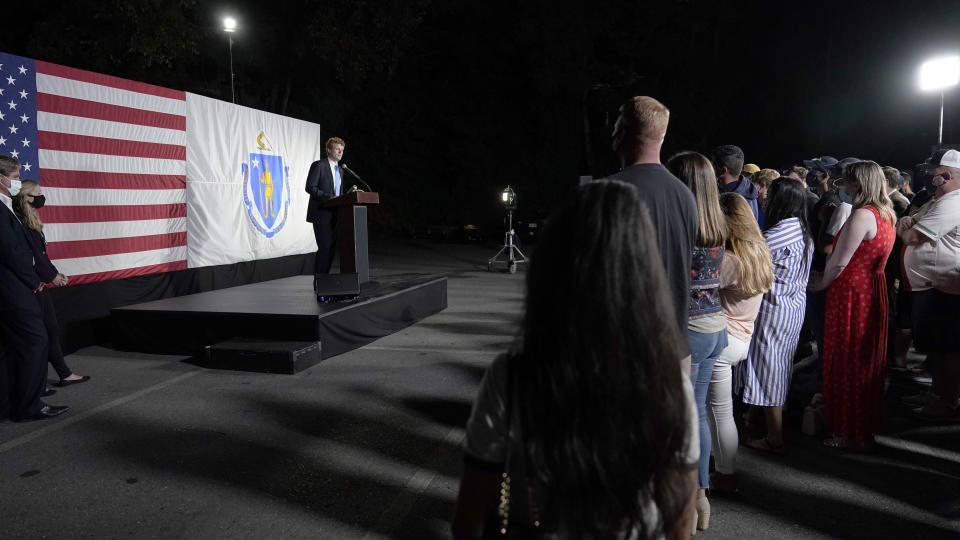 U.S. Rep. Joe Kennedy III speaks outside his campaign headquarters in Watertown, Mass., after conceding defeat to incumbent U.S. Sen. Edward Markey, Tuesday, Sept. 1, 2020, in the Massachusetts Democratic Senate primary. Listening at left are his twin brother Matthew and wife Lauren. (AP Photo/Charles Krupa)