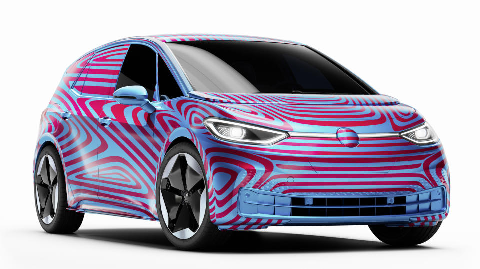 A preproduction Volkswagen ID.3, an electric hatchback, shown wrapped in blue and red camouflage.