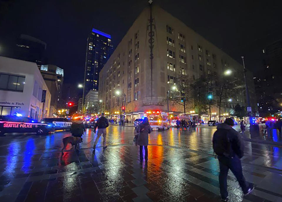 This photo provided by Suzanne Asprea shows the area of a deadly shooting in downtown Seattle on Wednesday, Jan. 22, 2020. A gunman opened fire in downtown Seattle on Wednesday night, killing at least one person and wounding several others, authorities said. Police Chief Carmen Best said what they believe is a lone suspect fled and police are searching for him. (Suzanne Asprea via AP)