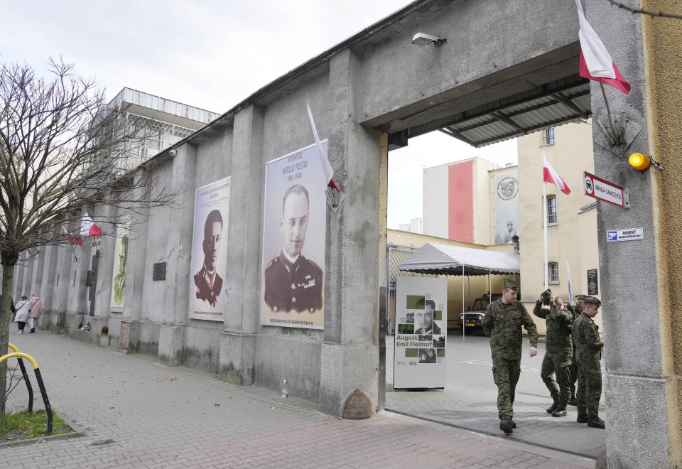 Polish soldiers visit the 'Museum of Cursed Soldiers and Political Prisoners of the Polish People's Republic' in Warsaw, Poland, Tuesday, April 11, 2023. Israel's national Holocaust memorial, Yad Vashem, has criticized a new agreement renewing Israeli school trips to Poland, saying it recommends a number of "problematic sites" that distort history. (AP Photo/Czarek Sokolowski)