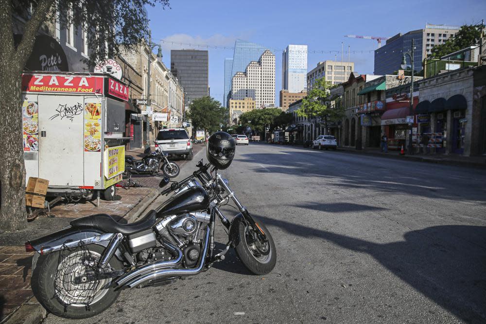 Some abandoned bikes are parked on the streets after a early morning shooting on Saturday, June 12, 2021 in downtown Austin, Texas. (Aaron Martinez/Austin American-Statesman via AP)