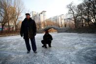 The Wider Image: On a frozen pond far from the Olympics, meet China's ice hockey veterans