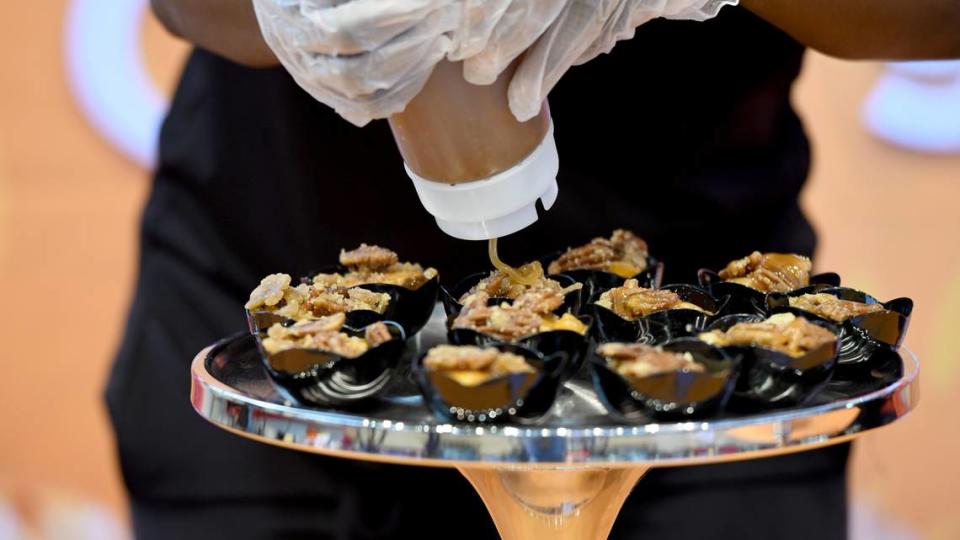 The Peach Cobbler Factorys’ Cinnamon Peach Praline Cobbler, one of the new food offerings at the 2023 North Carolina State Fair, displayed during a Media Day tasting on Oct. 9, 2023.