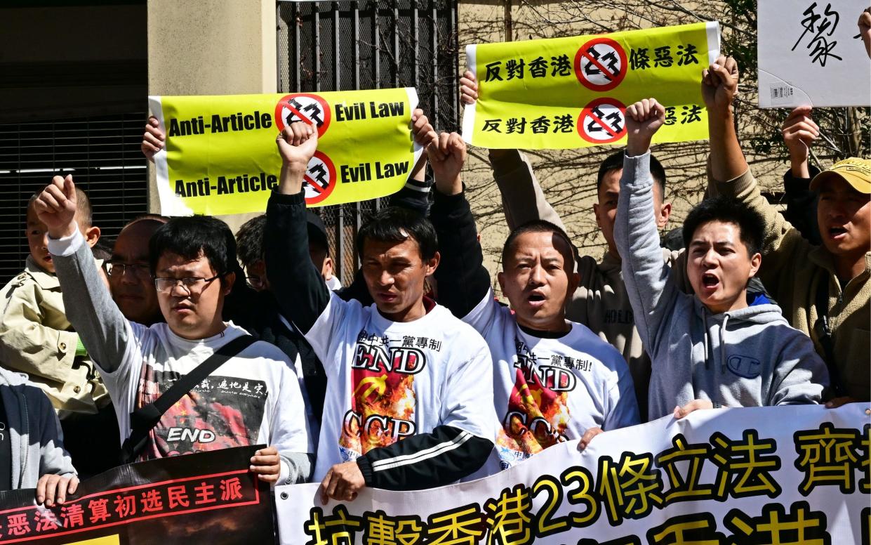 People gather to protest against Hong Kong's new national security law outside the Chinese embassy in Los Angeles