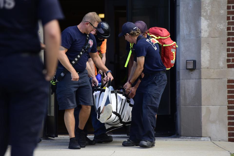 Port Huron Fire Department rescue crew carry out an injured civilian during the active killer training on the campus of St. Clair County Community College in Port Huron on Tuesday, August 9, 2022.