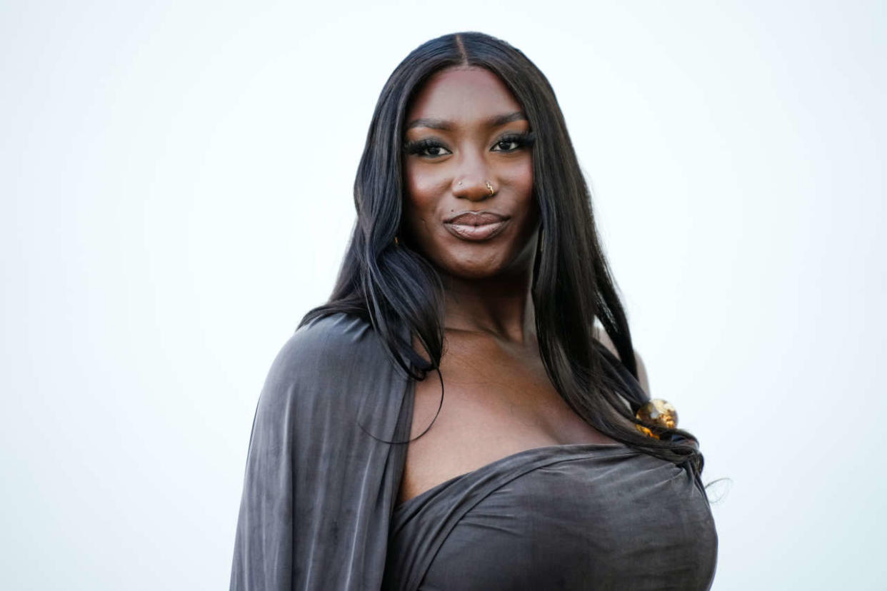 LE BOURGET, FRANCE - DECEMBER 12: Aya Nakamura wears a gray low-neck and sleeveless see-through dress, outside the 