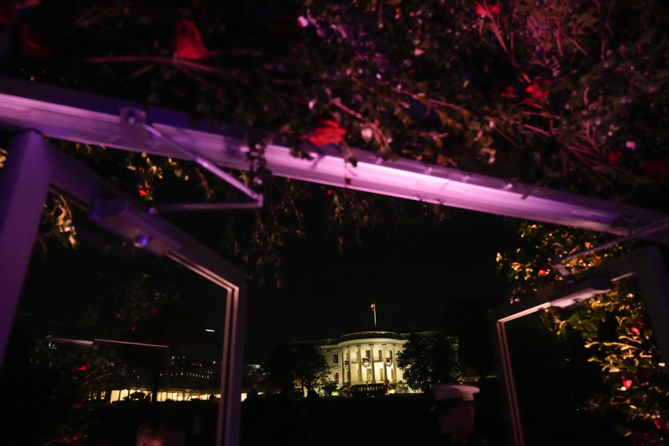 The White House is seen from the State Dinner location on the South Lawn before President Joe Biden and French President Emmanuel Macron exchanged a toast in Washington, Thursday, Dec. 1, 2022. (AP Photo/Andrew Harnik)