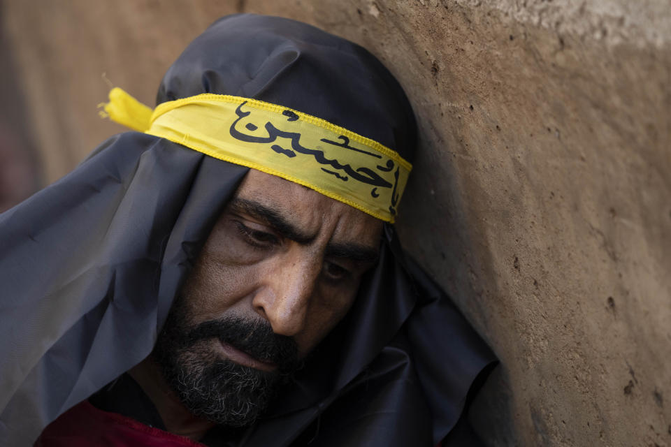 A Hezbollah supporter in a sermon listens to the story of Ashoura, the Shiite Muslim commemoration marking the death of Imam Hussein, the grandson of the Prophet Muhammad, at the Battle of Karbala in present-day Iraq in the 7th century, in the southern suburbs of Beirut, Lebanon, Saturday, July 29, 2023. The leader of Lebanon's Hezbollah militant group said Saturday that if the governments of Muslim-majority nations do not take action against countries that allow the desecration of the Quran, it is the responsibility of Muslims to "punish" those who facilitate attacks on the Islamic holy book. (AP Photo/Hassan Ammar)