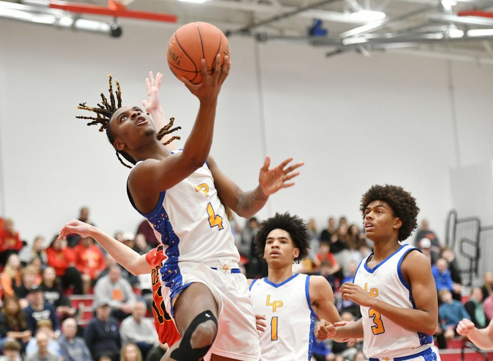 Lincoln Park’s Mikey Crawford shoots the ball during Friday’s PIAA Class 4A quarterfinal game against North Catholic at Fox Chapel High School.