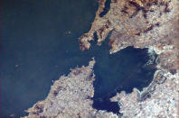 Here is a closer view of Qingdao (Tsingtao). Much easier to see the bridge in this photo. <a href="https://twitter.com/Cmdr_Hadfield/status/289077421754429440/photo/1" rel="nofollow noopener" target="_blank" data-ylk="slk:(Photo by Chris Hadfield/Twitter);elm:context_link;itc:0;sec:content-canvas" class="link ">(Photo by Chris Hadfield/Twitter)</a>