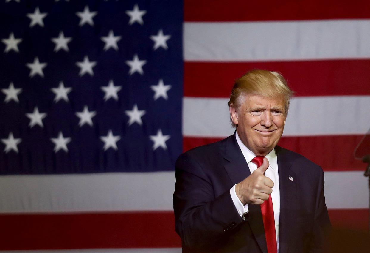 Republican presidential candidate Donald Trump gives a thumbs up during a campaign rally in October 2016 in West Palm Beach, Florida.