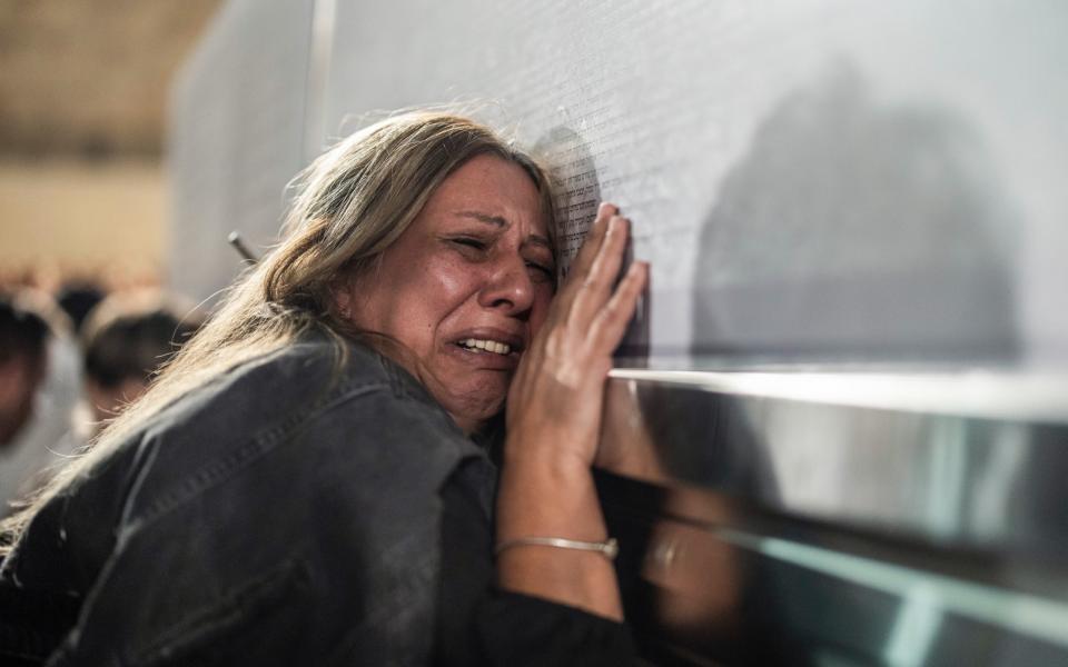 Israeli woman attends event at the West Wall in the memory of in memory of the victims of the Hamas attack on Oct 7
