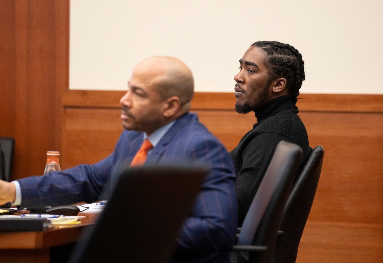 Isaiah Brown-Miller, 23, of the Columbus, Northeast Side, right, on Wednesday, Jan. 17, 2023 in Franklin County Common Pleas Court with his attorney, Lumumba Toure McCord, during Brown-Miller's third trial on kidnapping and aggravated robbery charges in connection with the December 2021 death of Columbus imam, Mohamed Hassan Adam.