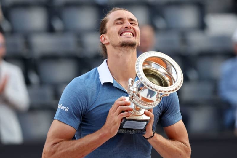 German tennis player Alexander Zverev celebrates with the trophy after defeting Chile's Nicolas Jarry to win the final tennis match of the Italian Open tennis tournament in Rome. Marco Iacobucci/Ipa Sport/IPA via ZUMA Press/dpa