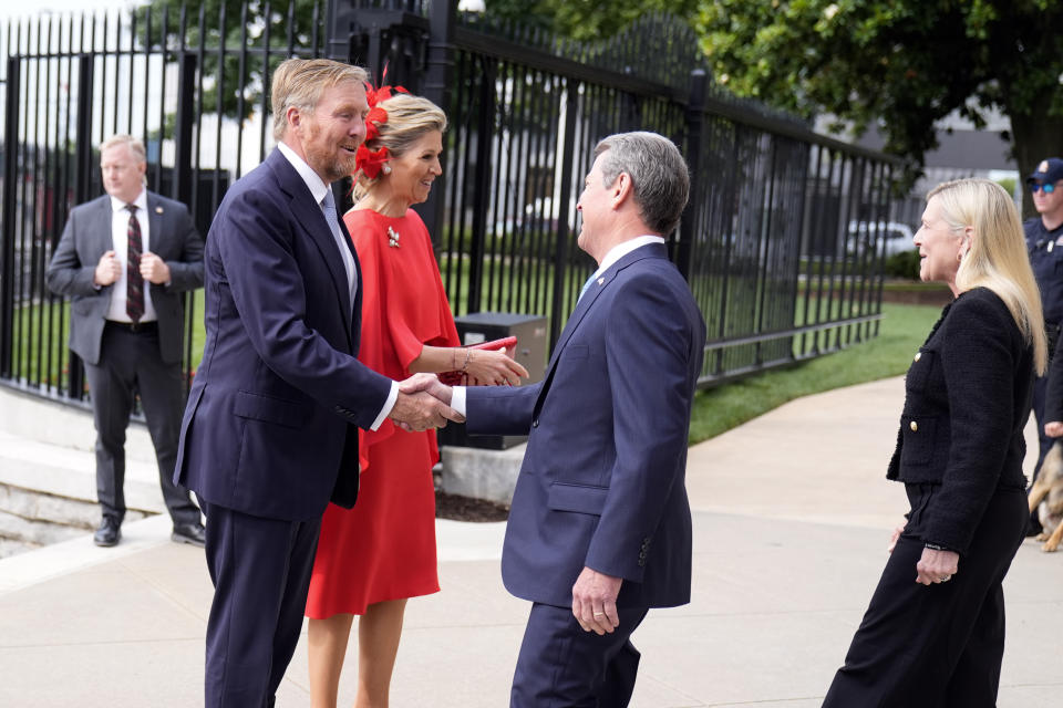 King Willem-Alexander and Queen Maxima of the Netherlands are greeted by Georgia Gov. Brian Kemp, right, at the Georgia State Capitol Building Monday, June 10, 2024, in Atlanta. (AP Photo/John Bazemore)