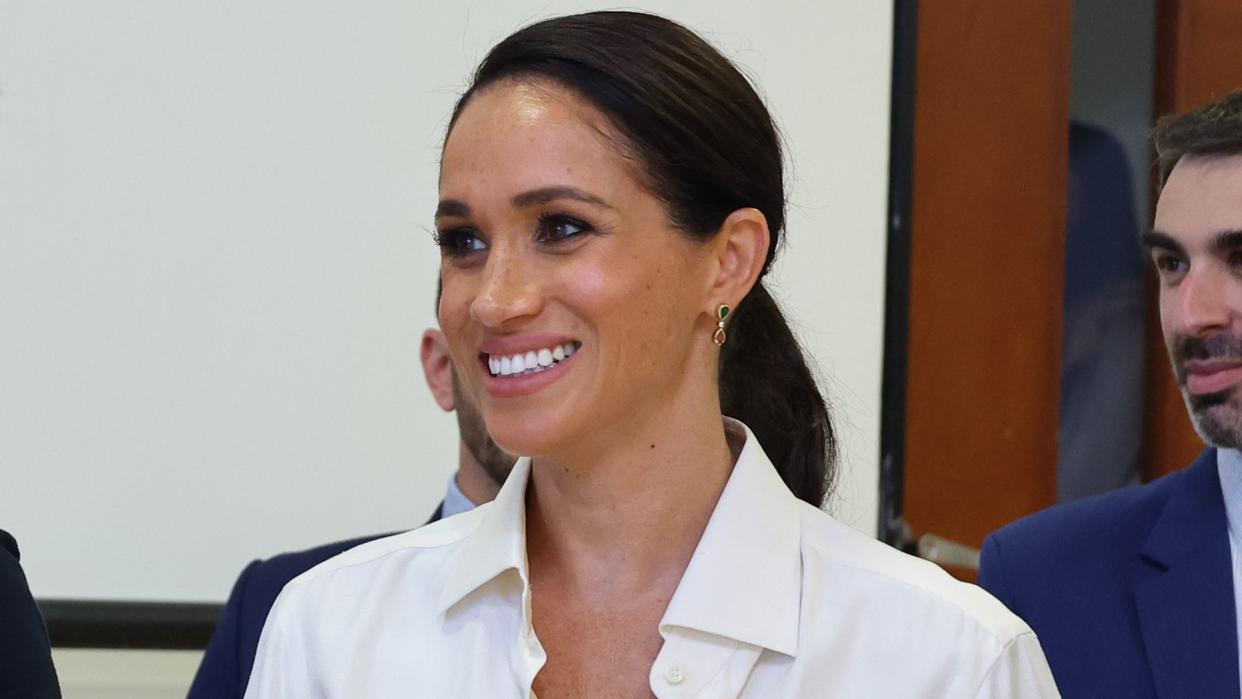 meghan markle in white shirt colombia day two