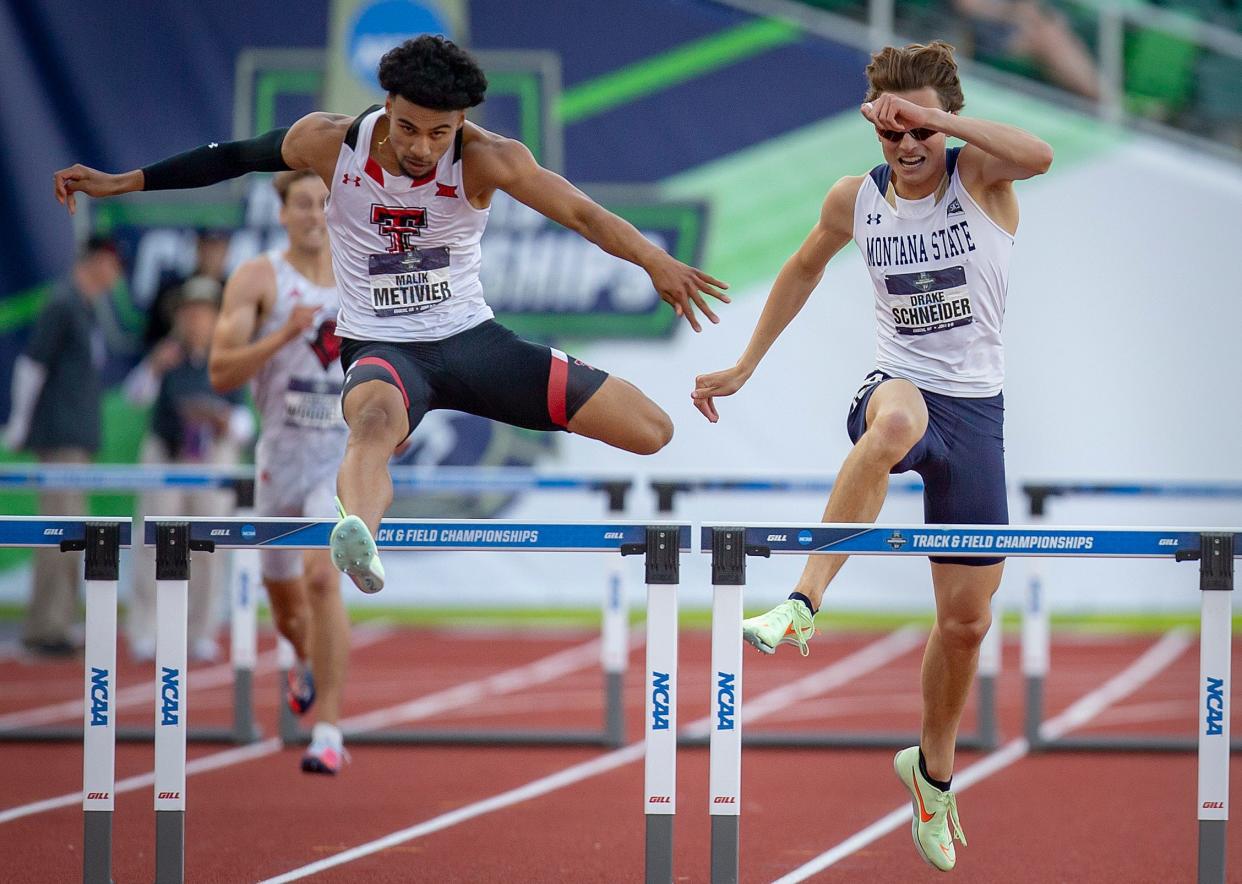 Texas Tech’s Malik Metivier, left, clears the final hurdle to win the semifinal round of the men’s 400 meter hurdles at the NCAA Outdoor Track & Field Championships Wednesday, June 8, 2022, at Hayward Field in Eugene, Ore.