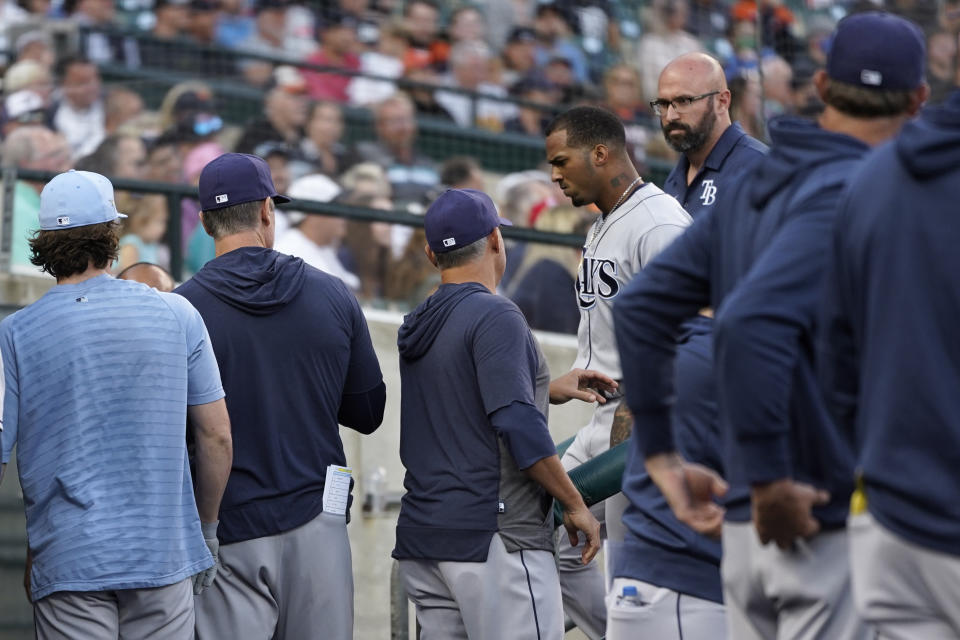 Tampa Bay Rays' Wander Franco walks to the locker room past teammates after being removed from the game against the Detroit Tigers in the first inning of a baseball game in Detroit, Friday, Sept. 10, 2021. (AP Photo/Paul Sancya)