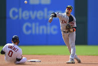 Detroit Tigers shortstop Javier Baez gets Cleveland Guardians' Andres Gimenez out at second base in the seventh inning of a baseball game, Sunday, May 22, 2022, in Cleveland. Steven Kwan would be out at first. The Tigers won 4-2. (AP Photo/David Dermer)