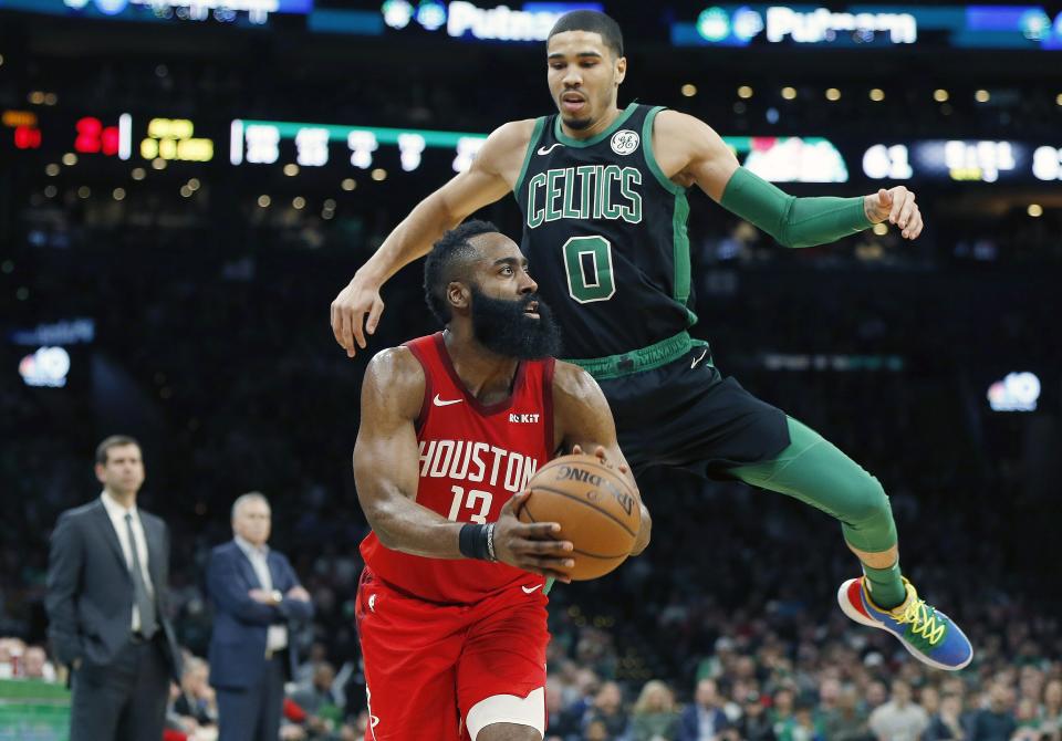 Houston Rockets' James Harden (13) prepares to shoot from three-point territory as Boston Celtics' Jayson Tatum (0) defends during the second half of an NBA basketball game in Boston, Sunday, March 3, 2019. (AP Photo/Michael Dwyer)