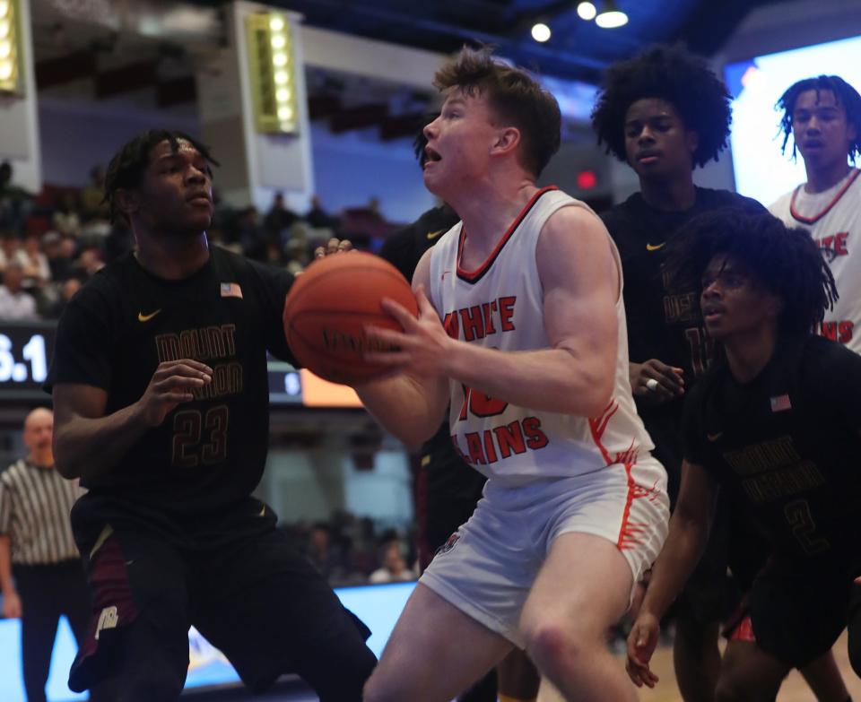 White Plains Luke Brooks (10) drives to the basket against Mt. Vernon during the Section 1 Class AAA semifinal at the Westchester County Center in White Plains Feb. 28, 2024.