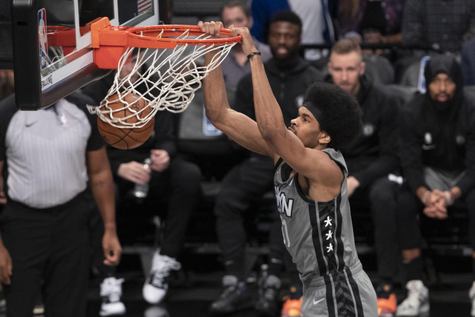 Brooklyn Nets center Jarrett Allen dunks during the first half of the team's NBA basketball game against the Houston Rockets, Friday, Nov. 1, 2019, in New York. (AP Photo/Mary Altaffer)