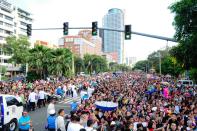 A sea of people gather to see the annual Metro Manila Film Festival Parade of Stars. (Angela Galia/NPPA Images)