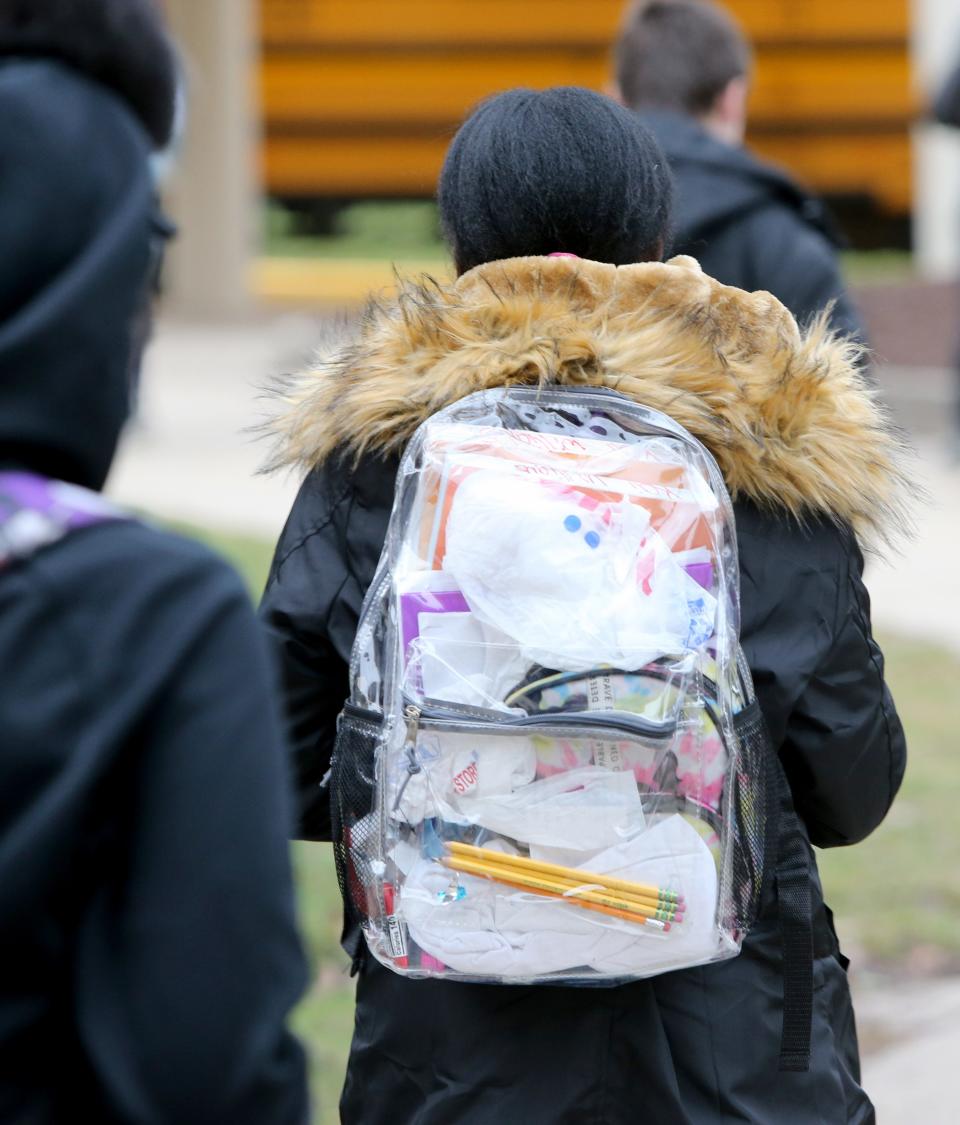 Students use clear backpacks for security concerns Thursday, Dec. 15, 2022, at Navarre Middle School in South Bend. Navarre is in the South Bend school district's empowerment zone.