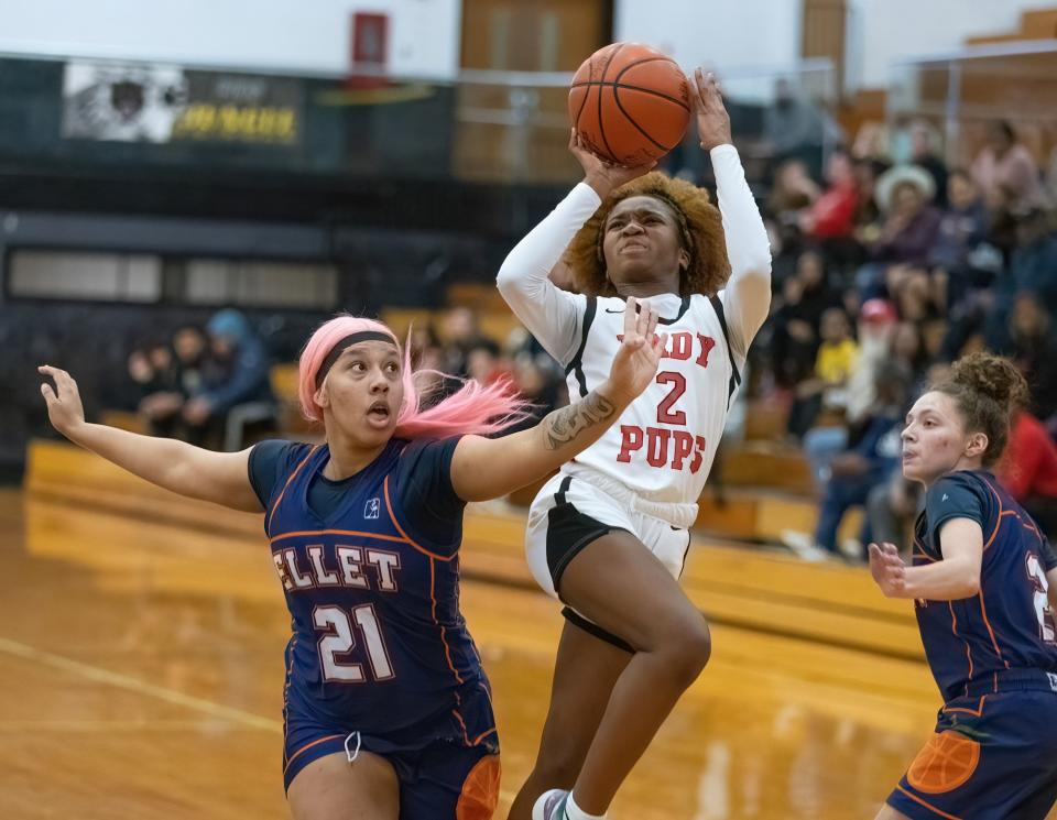 McKinley’s Paris Stokes shoots over Ellet’s Treyvianna Moore on Tuesday, Feb. 21, 2023.