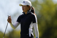Kelly Tan, of Malaysia, walks off the 14th green during the first round of the KPMG Women's PGA Championship golf tournament at the Aronimink Golf Club, Thursday, Oct. 8, 2020, in Newtown Square, Pa. (AP Photo/Chris Szagola)