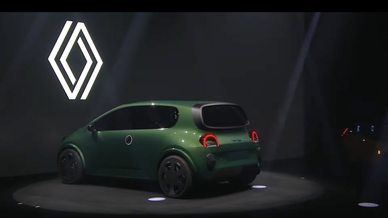 a green car on a stage