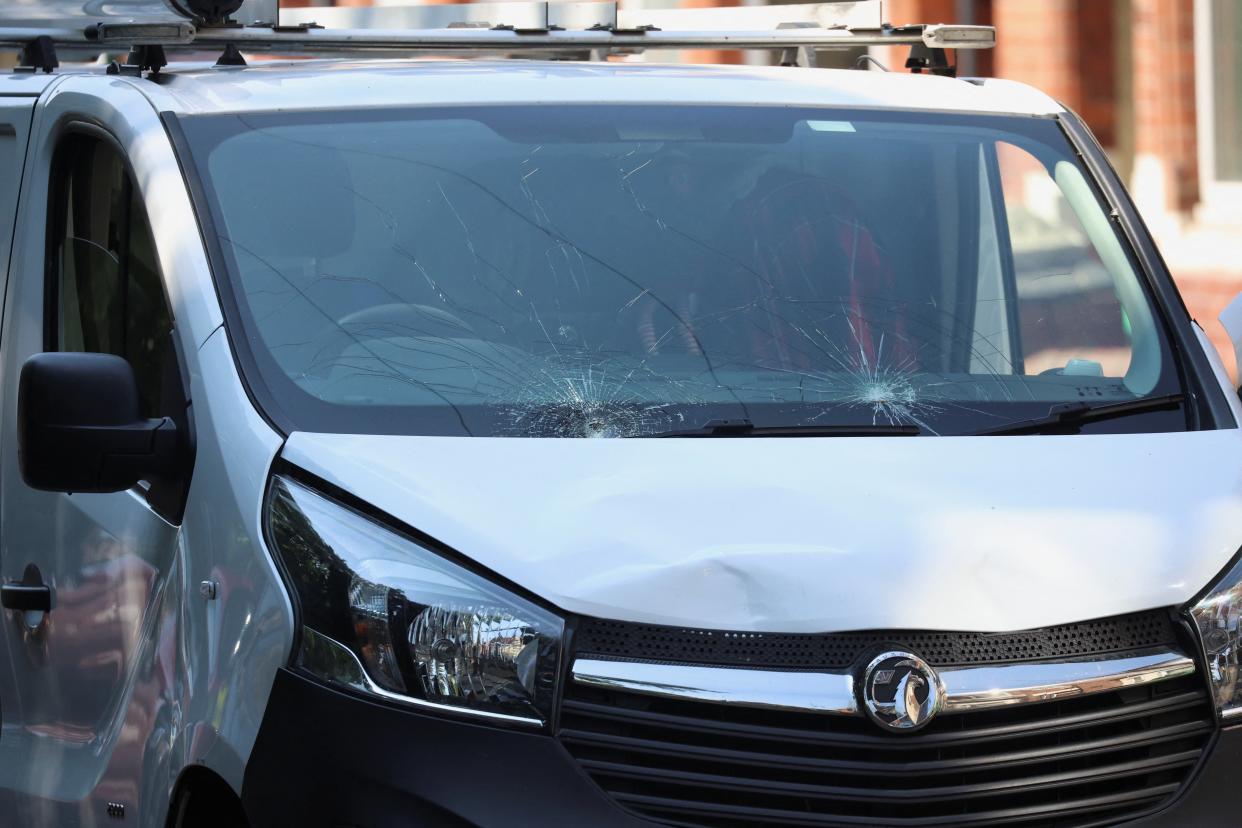 Damage is seen to the front of a white van inside a police cordon following a major incident in Nottingham city centre, (Reuters)