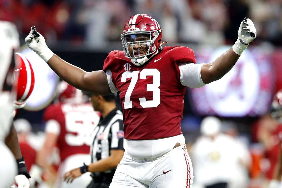 Evan Neal (73) of the Alabama Crimson Tide reacts after an Alabama touchdown in the second quarter of the SEC Championship game against the Georgia Bulldogs at Mercedes-Benz Stadium on Dec. 4, 2021, in Atlanta. (Todd Kirkland/Getty Images/TNS)