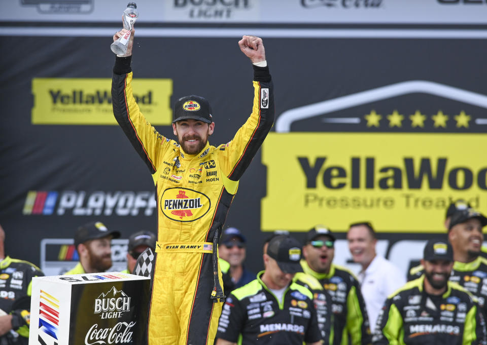 Ryan Blaney, front left, celebrates after winning a NASCAR Cup Series auto race at Talladega Superspeedway, Sunday, Oct. 1, 2023, in Talladega, Ala. (AP Photo/Julie Bennett)