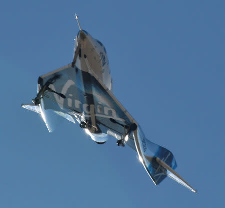 The SpaceShipTwo VSS Unity passenger craft makes its way back for a landing at Mojave Air and Space Port in Mojave, California, U.S., February 22, 2019. REUTERS/Gene Blevins