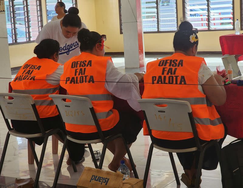 Election officials work on the day of the general elections, in Funafuti