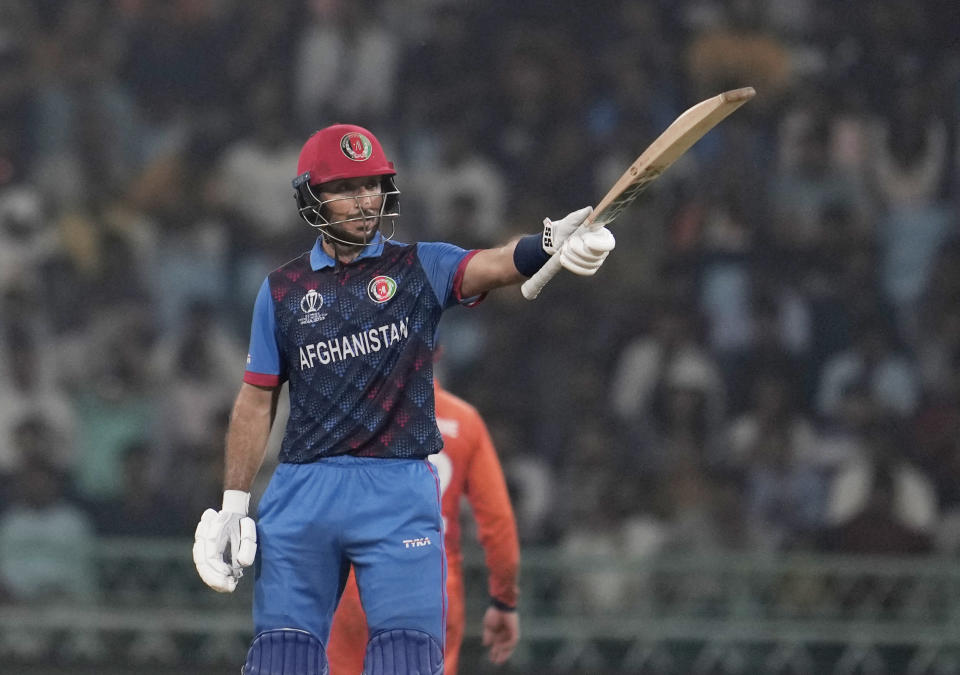 Afghanistan's Rahmat Shah celebrates his fifty runs during the ICC Men's Cricket World Cup match between Afghanistan and Netherlands in Lucknow, India, Friday, Nov. 3, 2023. (AP Photo/Altaf Qadri)
