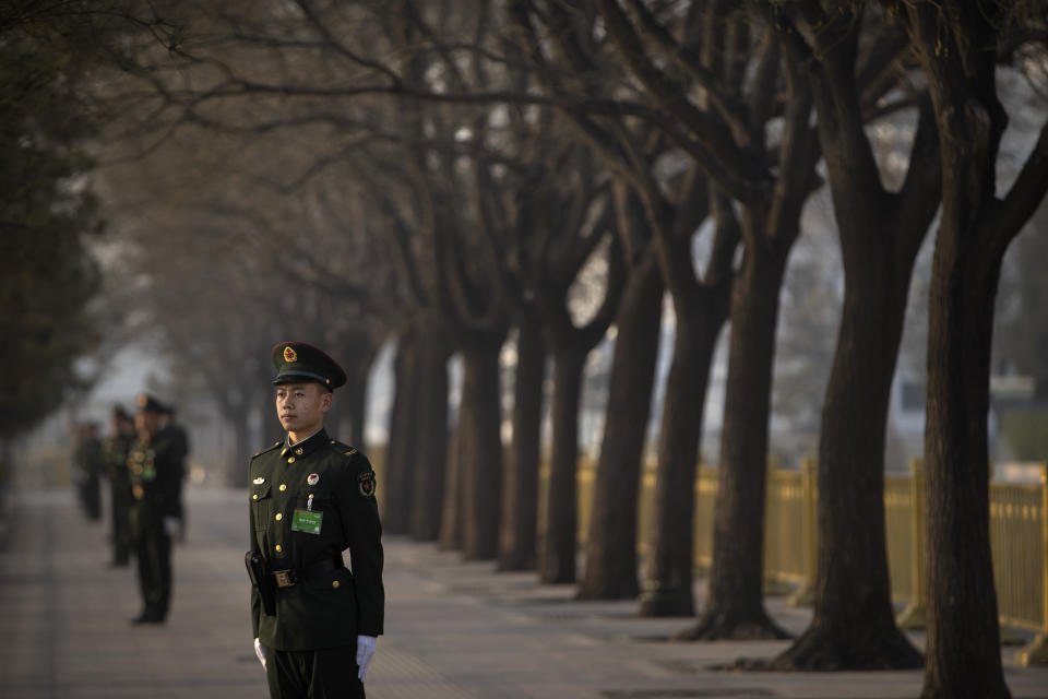 A Chinese paramilitary policeman stands guard outside of the Great Hall of the People before a meeting one day ahead of the opening session of China's National People's Congress (NPC) in Beijing, Monday, March 4, 2019. A year since removing any legal barrier to remaining China's leader for life, Xi Jinping appears firmly in charge, despite a slowing economy, an ongoing trade war with the U.S. and rumbles of discontent over his concentration of power. (AP Photo/Mark Schiefelbein)
