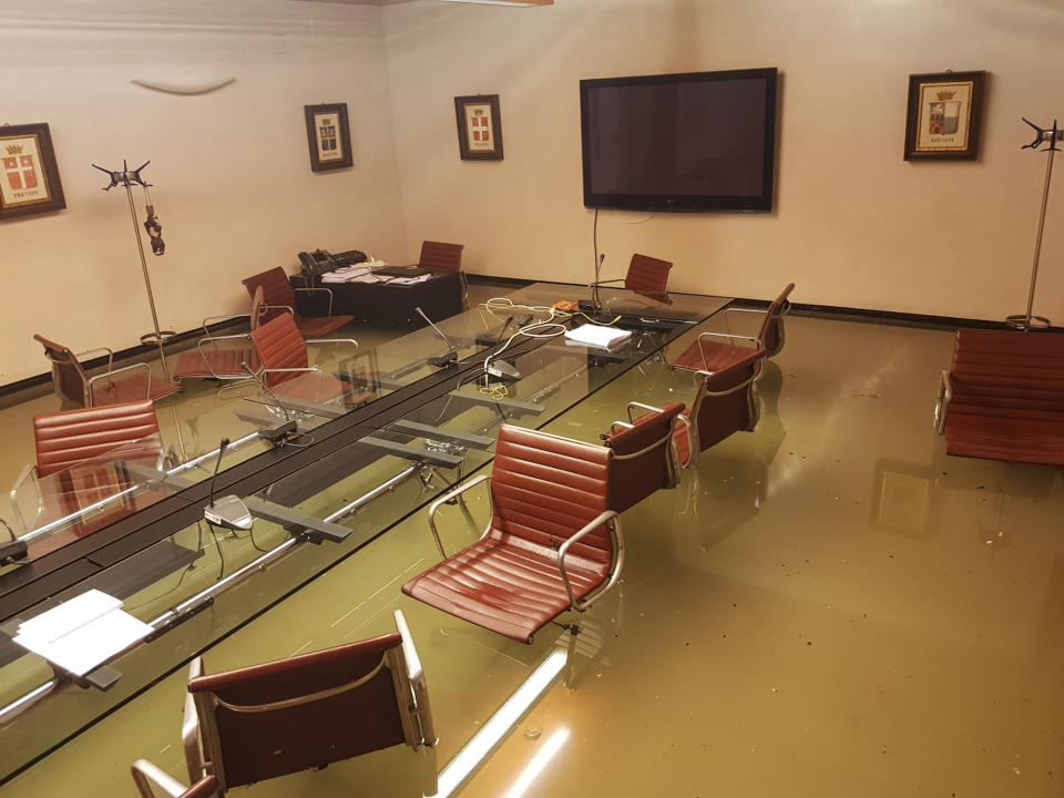 This picture made available Friday, Nov. 15, 2019 shows the Sala del Leone (Lion Hall) meeting room of the Veneto regional council in the Palazzo Ferro Fini palace, in Venice, Italy, early Wednesday Nov. 13, 2019 after its second-worst flooding on record late Tuesday when water levels reached 1.87 meters (6 feet, 1 inch). Exceptionally high tidal waters returned to Venice on Friday, prompting the mayor to close the iconic St. Mark’s Square and call for donations to repair the Italian lagoon city just three days after it experienced its worst flooding in 50 years. (Andrea Zanoni via AP)