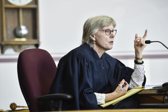 Judge Kathy Seeley listens to arguments during a status hearing for Held vs. Montana in the Lewis and Clark County Courthouse in Helena, Mont., on Friday, May 12, 2023. Seeley said a climate change lawsuit from young people challenging the state’s pro-fossil fuel policies will proceed to trial despite efforts by officials to derail the case. (Thom Bridge/Independent Record via AP)