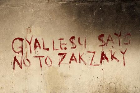 Graffiti on the walls of a house that was destroyed during clashes between Shi'ites and the army reads "Gyallesu says no to Zakzaky" in Zaria, Kaduna state, Nigeria, February 3, 2016. REUTERS/Afolabi Sotunde