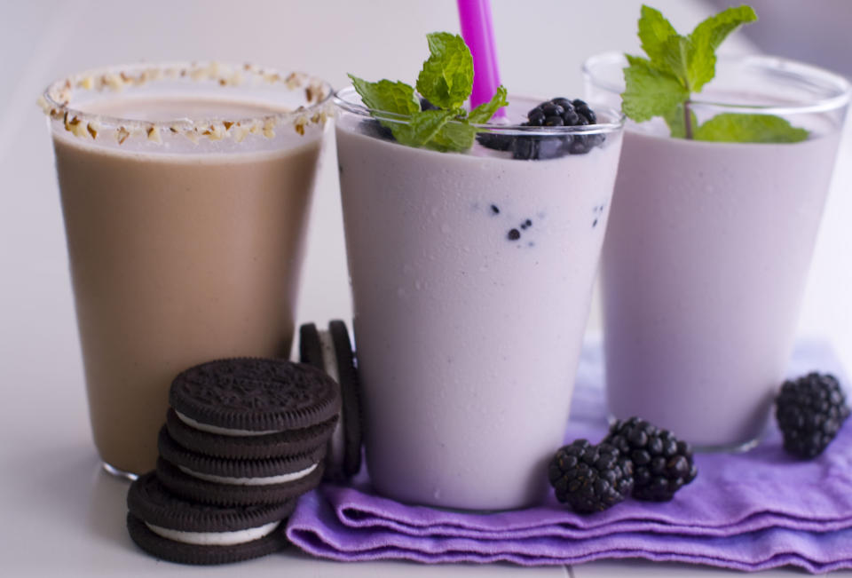 This April 23, 2012, photo shows a purple velvet milkshake, right, and a toasted malt milkshake, left, in Concord, N.H. (AP Photo/Matthew Mead)