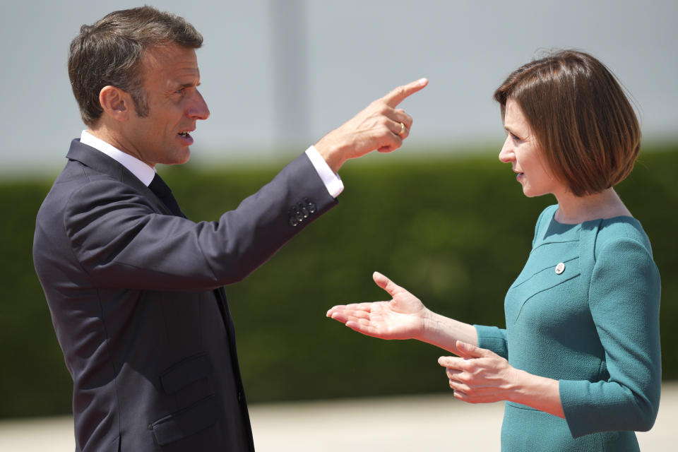 Moldova's President Maia Sandu, right, greets France's President Emmanuel Macron during arrivals for the European Political Community Summit at the Mimi Castle in Bulboaca, Moldova, Thursday, June 1, 2023. Leaders are meeting in Moldova Thursday for a summit aiming to show a united front in the face of Russia's war in Ukraine and underscore support for the Eastern European country's ambitions to draw closer to the West and keep Moscow at bay. (AP Photo/Vadim Ghirda)