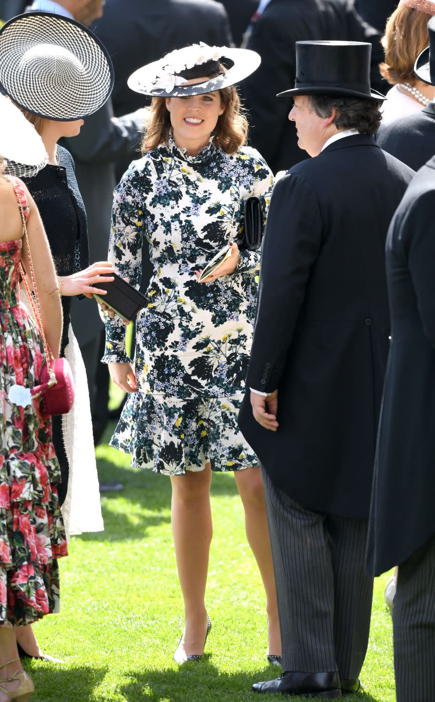 <p>Eugenie knows how to garner attention with her fashion choices. But in 2018, she went for classic ladylike details with a silk floral dress that pays subtle homage to her grandmother, Queen Elizabeth. Apparently, the designer’s inspiration was the <a href="https://www.goodhousekeeping.com/beauty/fashion/a21763903/princess-eugenie-royal-ascot-queen-elizabeth-outfit/" rel="nofollow noopener" target="_blank" data-ylk="slk:Queen’s own 1950’s high necklines, button details, and flounced hem;elm:context_link;itc:0" class="link ">Queen’s own 1950’s high necklines, button details, and flounced hem</a>. </p>